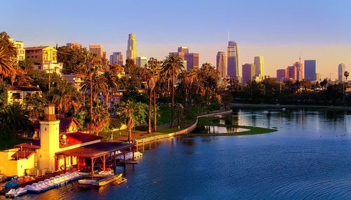 Buildings by swimming pool in city against sky, down town, los angeles