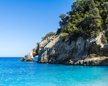 The famous stone arch of cala goloritze on the gulf of orosei in sardinia, italy