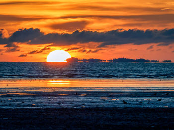 Scenic view of sea against sky during sunset