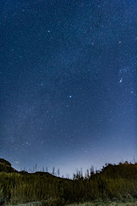 Scenic view of star field against sky at night