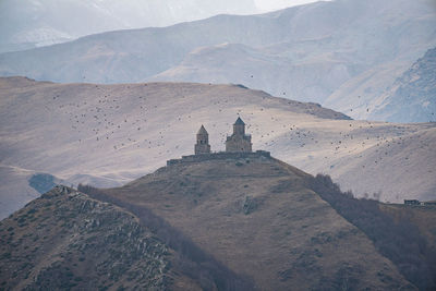 View of building with mountain range in background