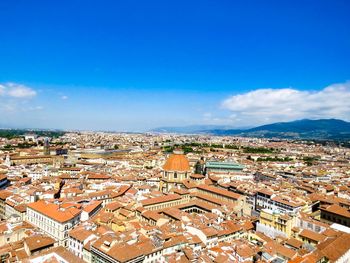 High angle view of townscape against blue sky