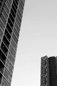 Low angle view of skyscrapers against clear sky