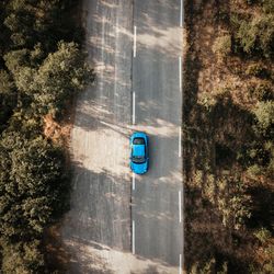 High angle view of blue car on road