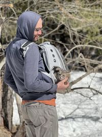 Rear view of man standing in forest