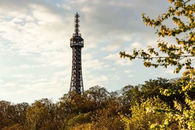 Low angle view of tower against cloudy sky