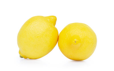 Close-up of yellow lemon against white background