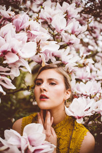 Portrait of woman with pink flowers