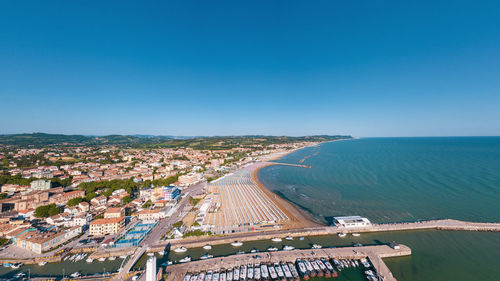 High angle view of sea against clear blue sky