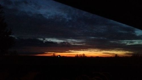 Silhouette of landscape against dramatic sky