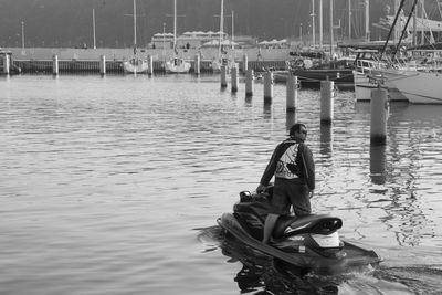 Man on boat moored at shore