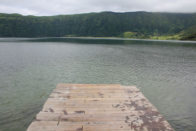 High angle view of pier over lake against sky