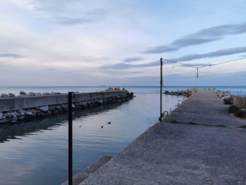 Pier over sea against sky in ancona 