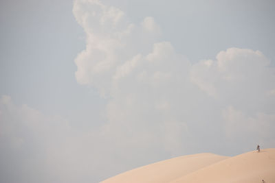 Scenic view of clouds over landscape against sky