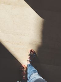 Low section of woman on floor