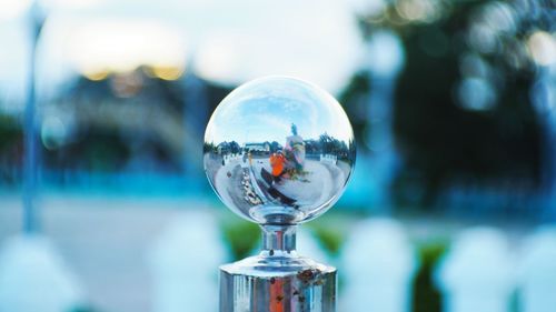 Close-up of crystal ball against blurred background