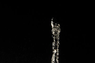 Close-up of sparkler over black background