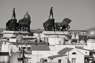 Statue of birds in city