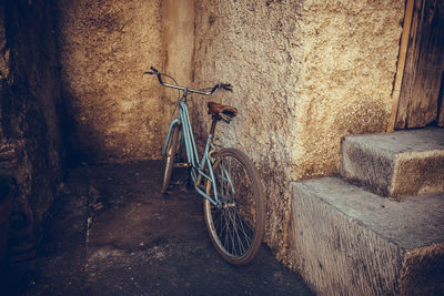 Bicycle leaning on wall