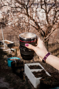 Cropped hand of man holding coffee