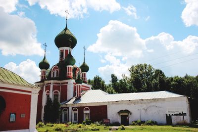 Church amidst buildings against sky