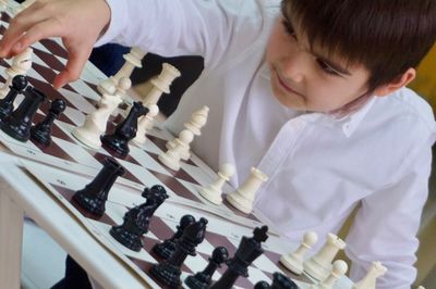 High angle view of boys playing on table