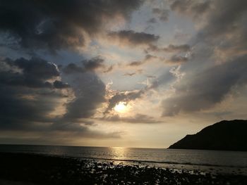 Scenic view of sea against sky at sunset