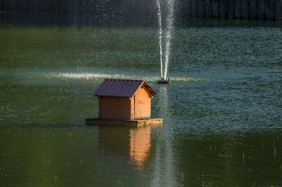 Duck house in the city pond