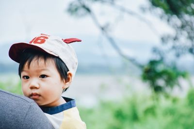 Portrait of cute boy looking away