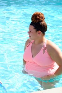 Woman looking at swimming pool