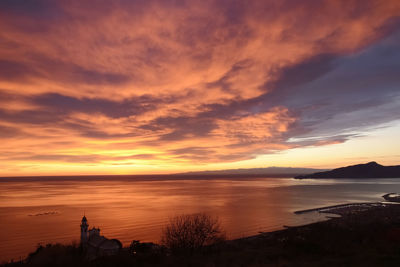 Scenic view of sea against orange sky