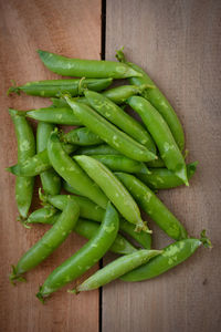 Close-up of green chili peppers on table