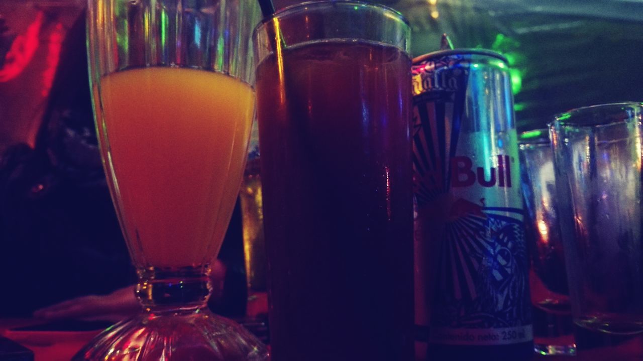 drink, indoors, drinking glass, food and drink, refreshment, still life, alcohol, table, glass - material, close-up, multi colored, transparent, glass, freshness, red, focus on foreground, cocktail, wineglass, illuminated, no people