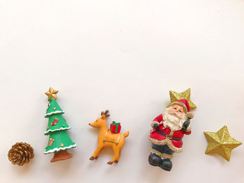 Toys on table against white background