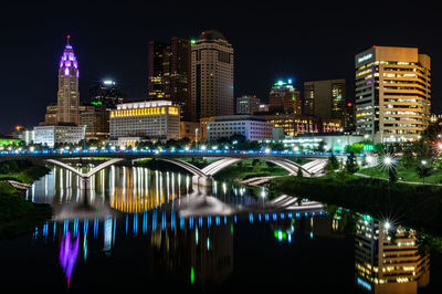 Illuminated buildings in city at night