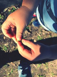 Close-up of man holding hands