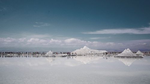 Panoramic view of snowcapped mountains against sky