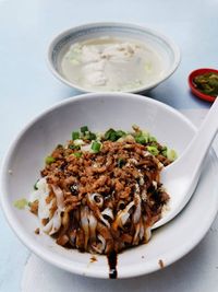 High angle view of asian noodle or kuey teow meal served on table.