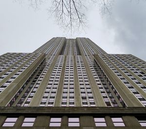 Low angle view of office building against sky