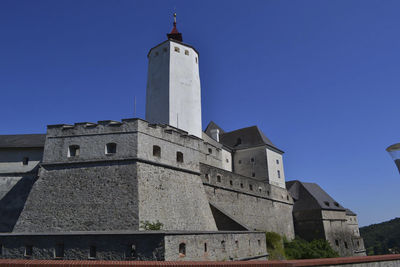 An old castle on the mountains in summer