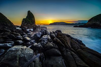 Scenic view of sea against sky during sunset