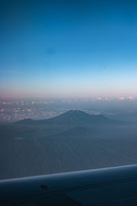 Scenic view of mountains against sky during sunset