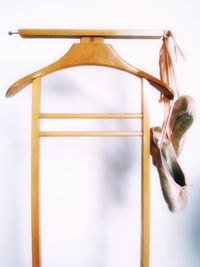 Ballet shoes hanging against wall