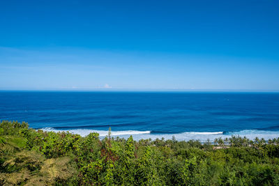 Scenic view of sea against blue sky