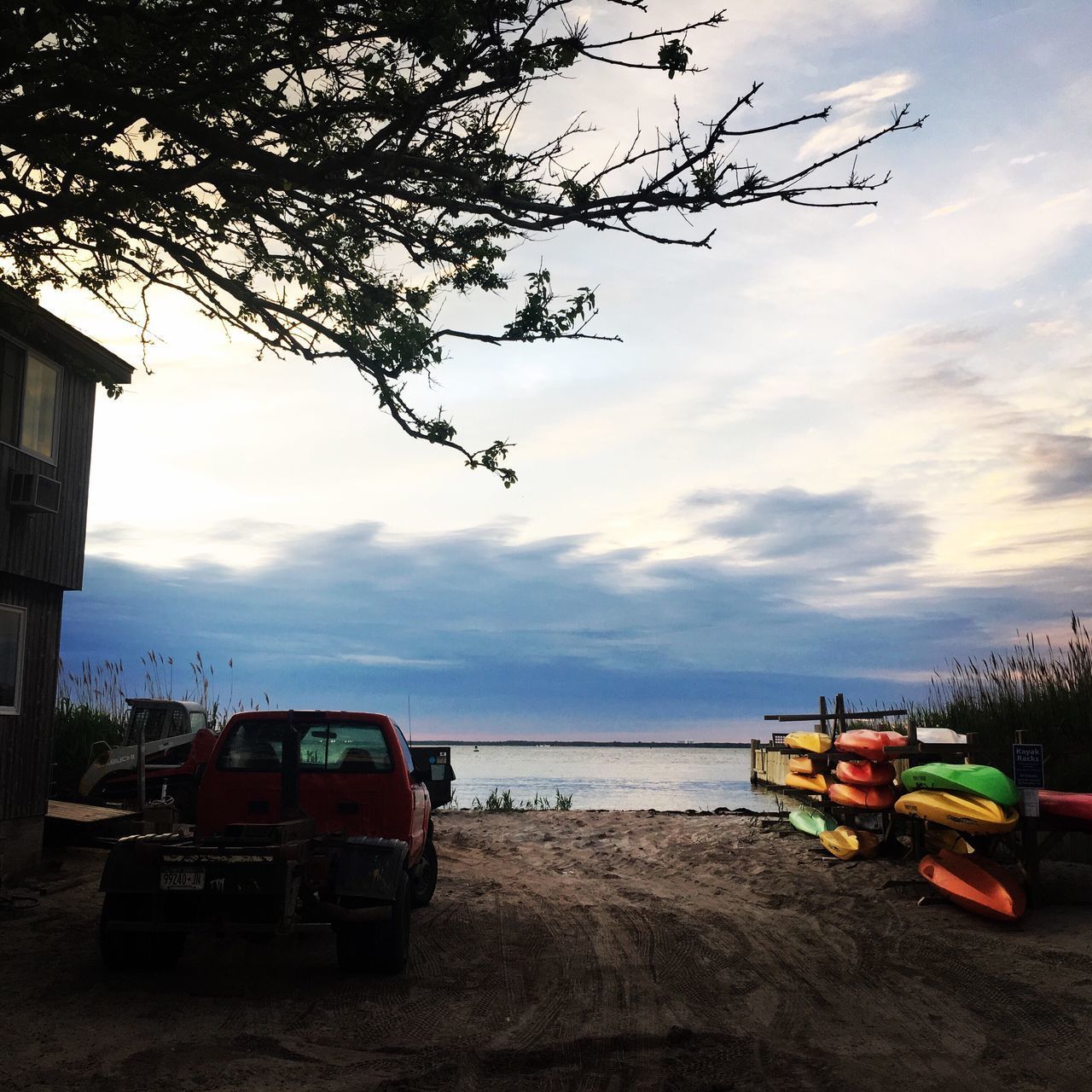 CAR ON BEACH AGAINST SKY