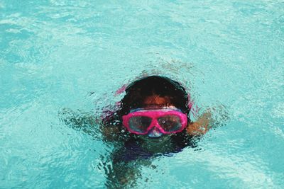 Portrait of man swimming in pool