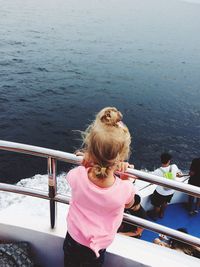 Rear view of girl looking at sea