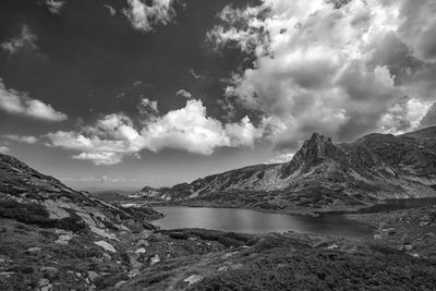 Scenic view of lake and mountains against sky