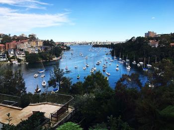 High angle view of boats in sea by buildings