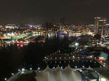 High angle view of illuminated buildings in city at night